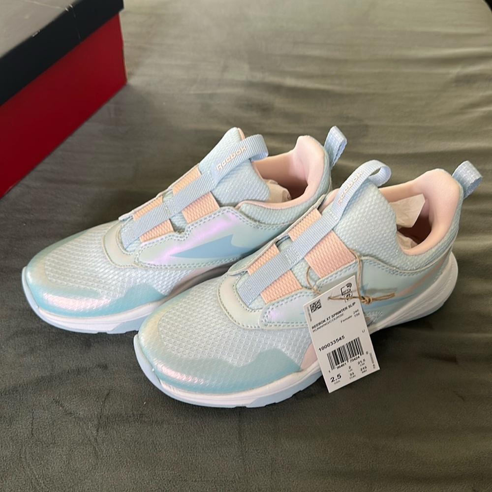 Brand new girls slip on Reebok sneakers